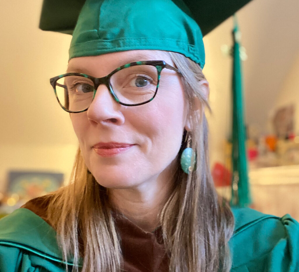 Kara Melissa in graduation cap and gown